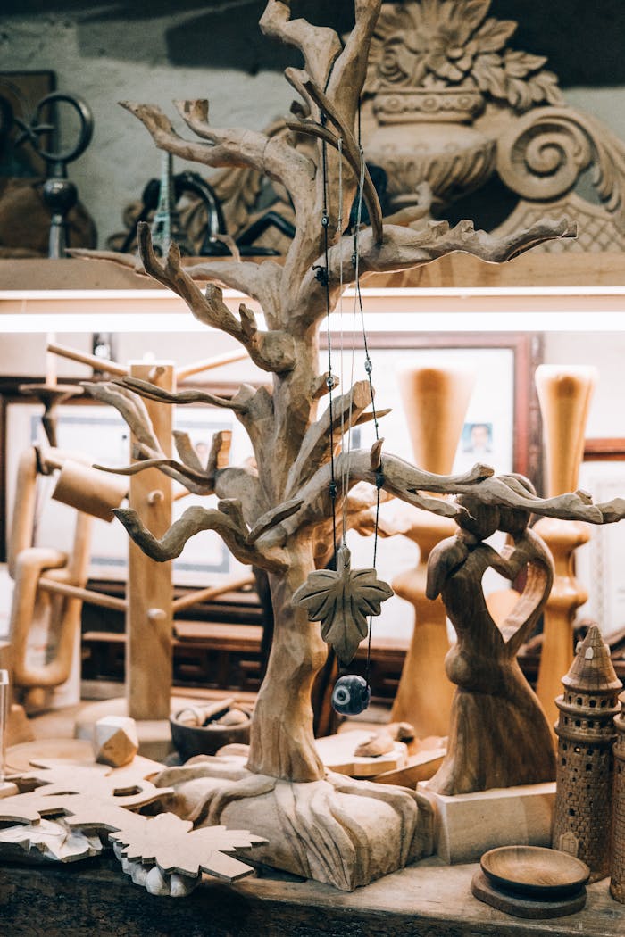 services-01 Wooden sculptures and carvings arranged in an artisan's workshop, showcasing craftsmanship.