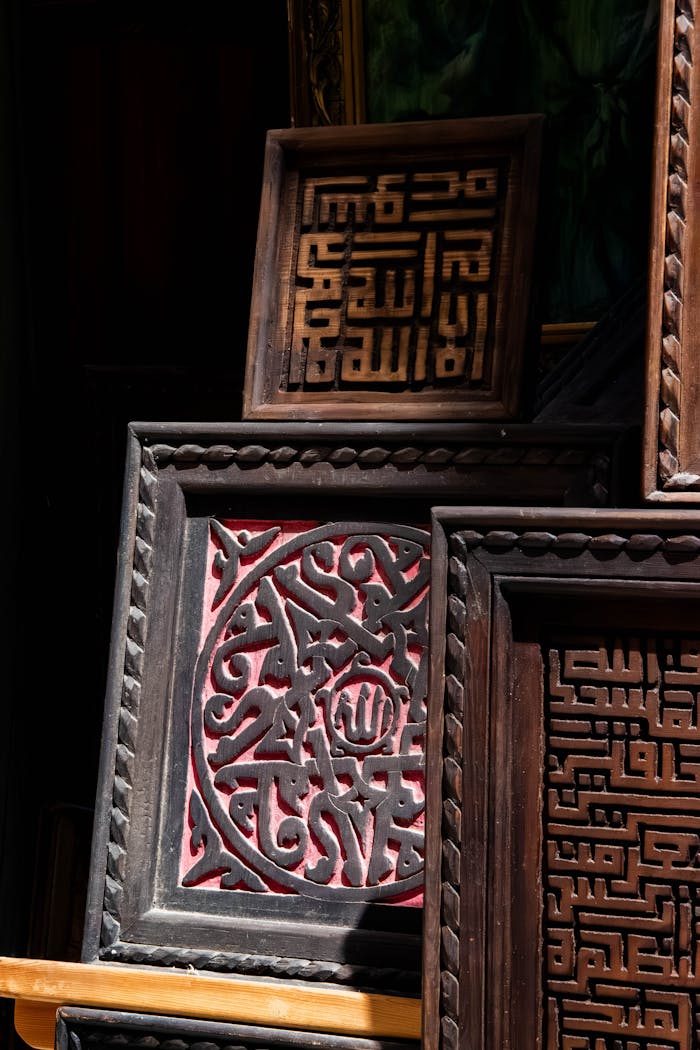 Detailed wooden panels featuring Arabic calligraphy showcasing traditional Moroccan craftsmanship.